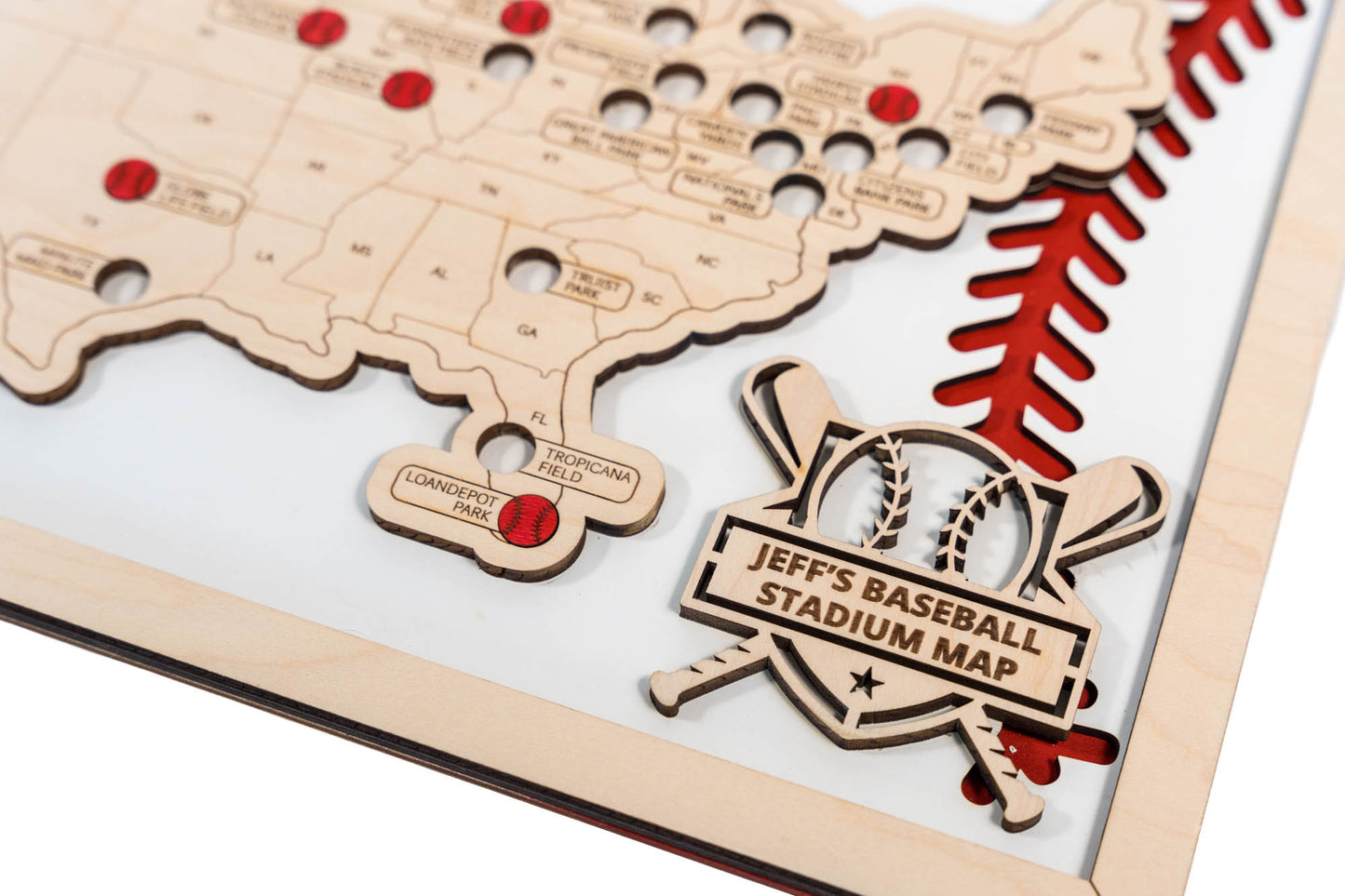 Wooden baseball stadium tracker map with red markers to commemorate ballpark visits