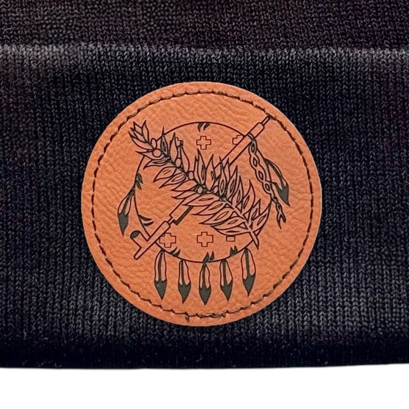 Alternate angle of a black beanie highlighting the Oklahoma symbol leather patch.