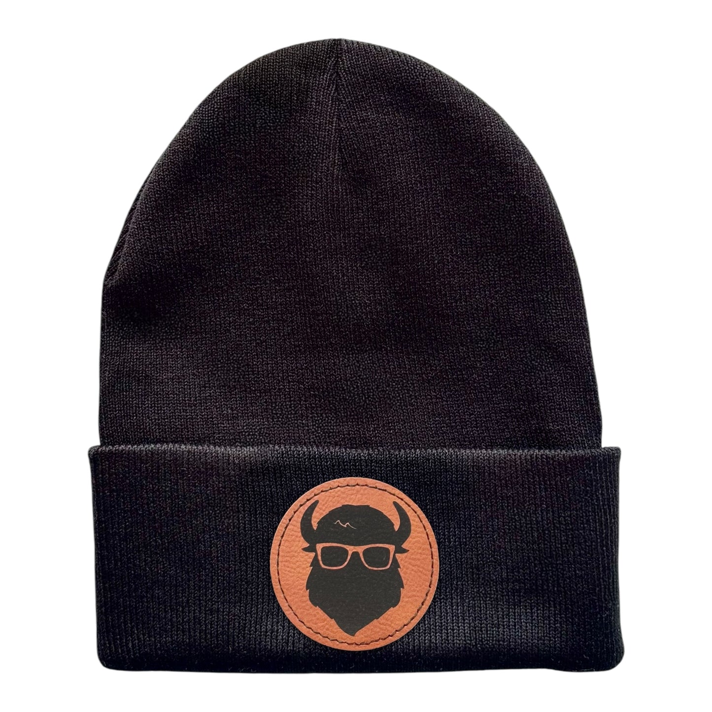 Black beanie featuring “The Curious Bison” logo on a leather patch, shown in full view.