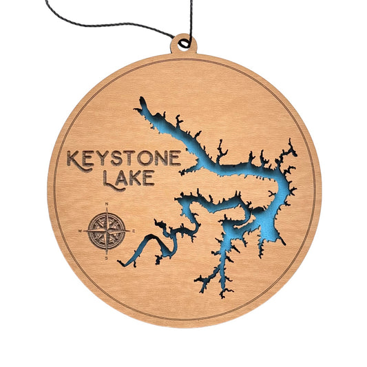 Round wooden ornament featuring Keystone Lake map with intricate laser-cut design and vibrant blue water inlay