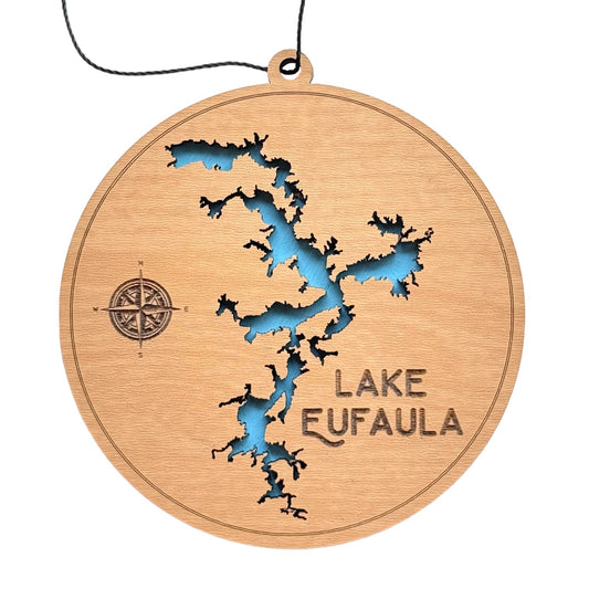 Round wooden ornament of Lake Eufaula with intricate laser-cut map design and vibrant blue lake inlay