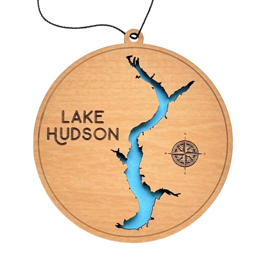 Round wooden ornament featuring Lake Hudson map with laser-cut details, blue water inlay, and compass engraving