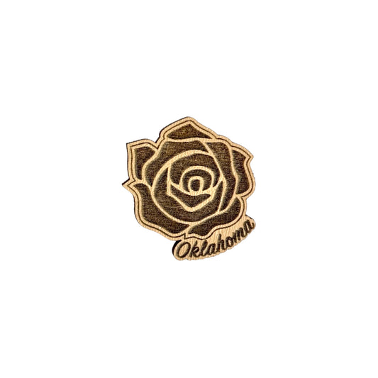 Wooden pin shaped like an Oklahoma rose with a secure pin-back that inserts into a durable rubber fastener.